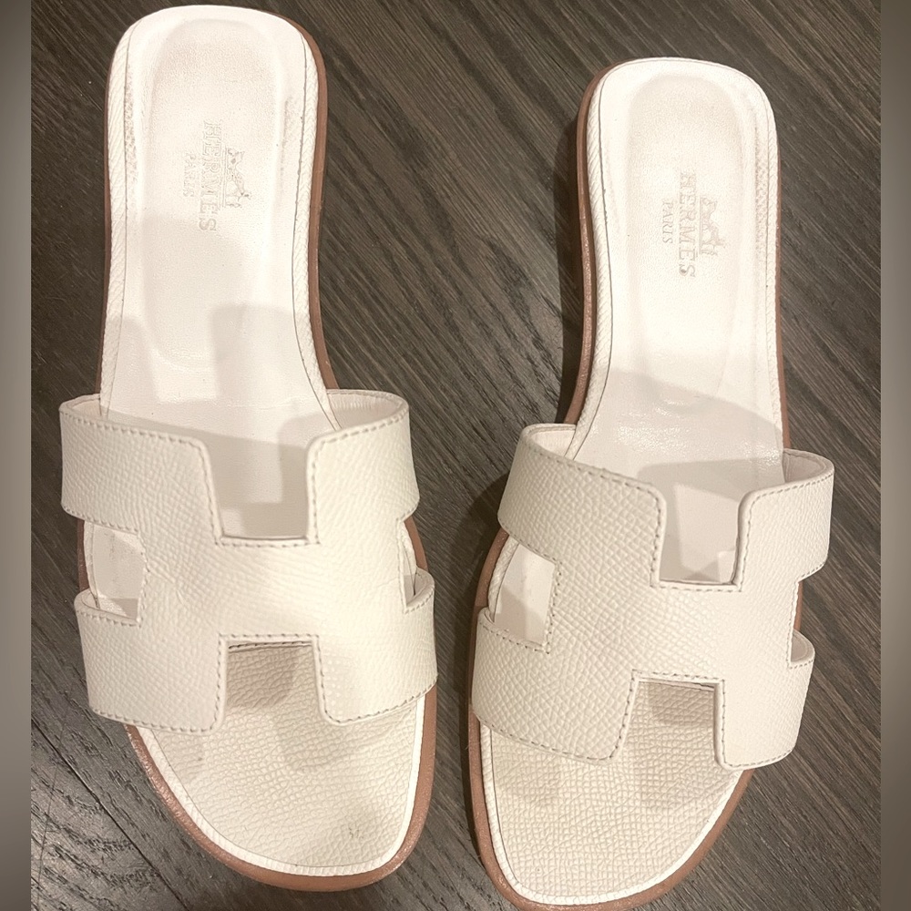 Hermes Oran sandals in white.